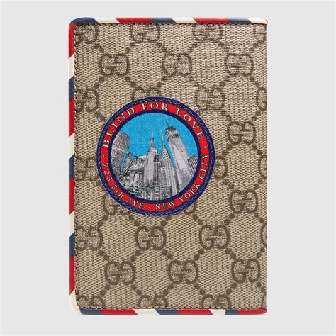 gucci supreme passport holder